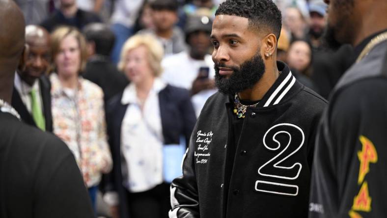 Dec 5, 2022; Dallas, Texas, USA; NFL wide receiver free agent Odell Beckham Jr. (black jacket) after the game between the Dallas Mavericks and the Phoenix Suns at the American Airlines Center. Mandatory Credit: Jerome Miron-USA TODAY Sports