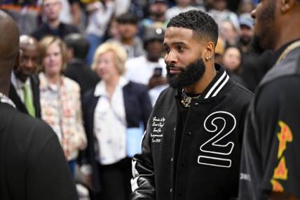 Dec 5, 2022; Dallas, Texas, USA; NFL wide receiver free agent Odell Beckham Jr. (black jacket) after the game between the Dallas Mavericks and the Phoenix Suns at the American Airlines Center. Mandatory Credit: Jerome Miron-USA TODAY Sports