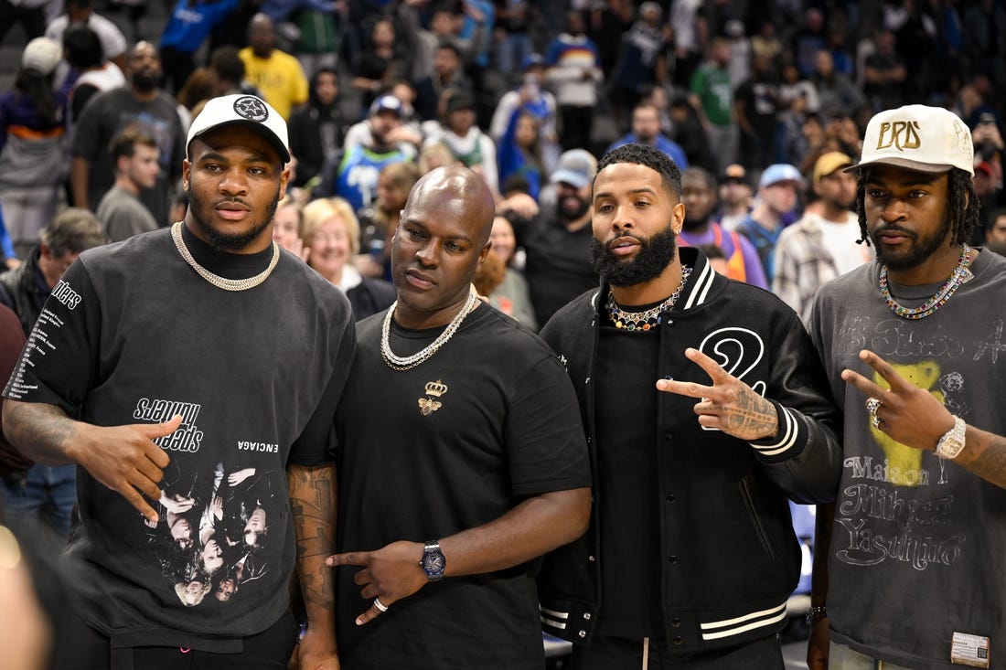 Dec 5, 2022; Dallas, Texas, USA; (from left) Dallas Cowboys linebacker Micah Parsons (white hat) and wide receiver free agent Odell Beckham Jr. (black jacket) and cornerback Trevon Diggs (white hat) pose for a photo after the game between the Dallas Mavericks and the Phoenix Suns at the American Airlines Center. Mandatory Credit: Jerome Miron-USA TODAY Sports