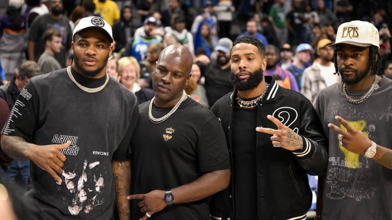 Dec 5, 2022; Dallas, Texas, USA; (from left) Dallas Cowboys linebacker Micah Parsons (white hat) and wide receiver free agent Odell Beckham Jr. (black jacket) and cornerback Trevon Diggs (white hat) pose for a photo after the game between the Dallas Mavericks and the Phoenix Suns at the American Airlines Center. Mandatory Credit: Jerome Miron-USA TODAY Sports