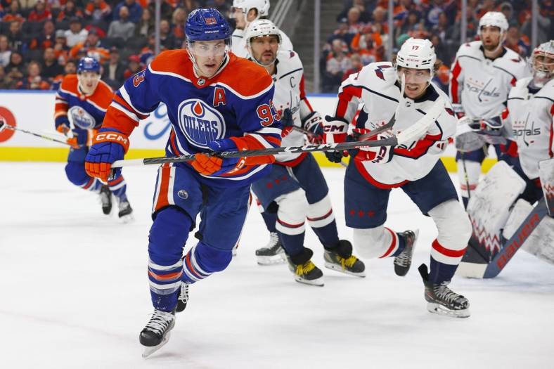 Dec 5, 2022; Edmonton, Alberta, CAN; Edmonton Oilers forward Ryan Nugent-Hopkins (93) chases a loose puck during the third period at Rogers Place. Mandatory Credit: Perry Nelson-USA TODAY Sports