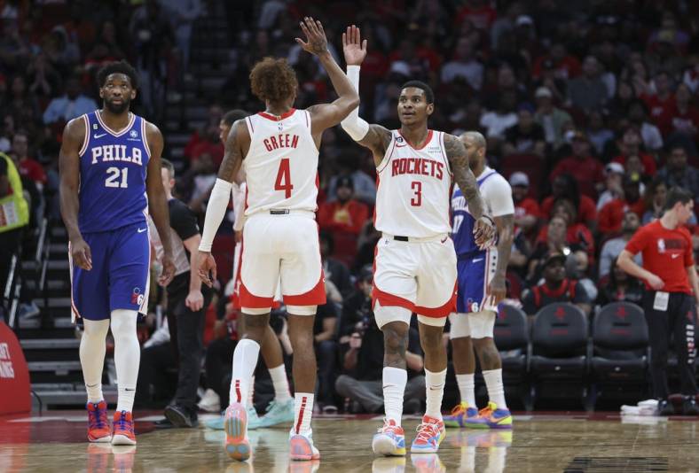 Dec 5, 2022; Houston, Texas, USA; Houston Rockets guard Kevin Porter Jr. (3) and guard Jalen Green (4) react after a play during the third quarter against the Philadelphia 76ers at Toyota Center. Mandatory Credit: Troy Taormina-USA TODAY Sports