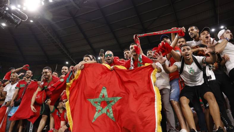 Dec 6, 2022; Ar Rayyan, QATAR; Morocco supporters celebrate the victory against Spain in penalty kicks in the round of sixteen match of the 2022 FIFA World Cup at Education City Stadium. Mandatory Credit: Yukihito Taguchi-USA TODAY Sports