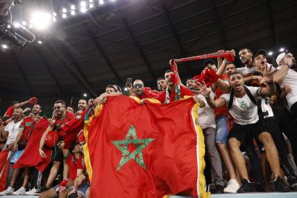 Dec 6, 2022; Ar Rayyan, QATAR; Morocco supporters celebrate the victory against Spain in penalty kicks in the round of sixteen match of the 2022 FIFA World Cup at Education City Stadium. Mandatory Credit: Yukihito Taguchi-USA TODAY Sports