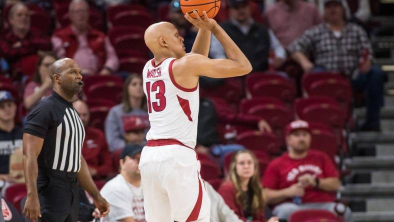 Dec 6, 2022; Fayetteville, Arkansas, USA;  Arkansas Razorbacks guard Jordan Walsh (13) shoots the ball during the first half against the UNC-Greensboro Spartans at Bud Walton Arena. Mandatory Credit: Brett Rojo-USA TODAY Sports