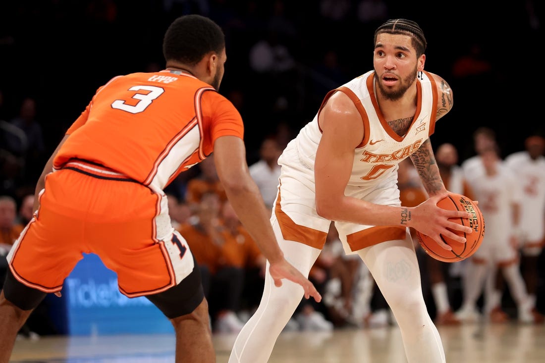 Dec 6, 2022; New York, New York, USA; Texas Longhorns forward Timmy Allen (0) controls the ball against Illinois Fighting Illini guard Jayden Epps (3) during the first half at Madison Square Garden. Mandatory Credit: Brad Penner-USA TODAY Sports