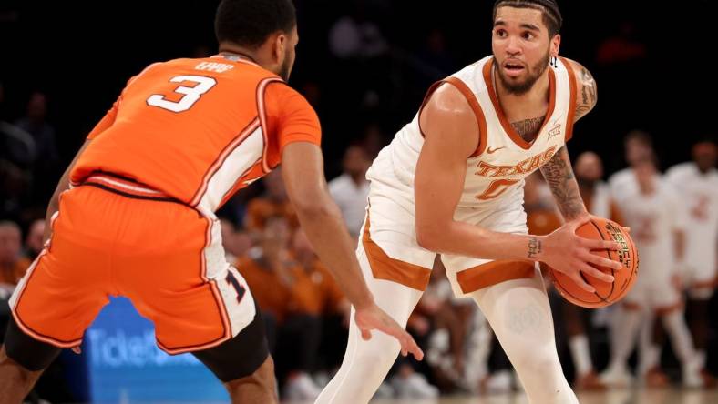 Dec 6, 2022; New York, New York, USA; Texas Longhorns forward Timmy Allen (0) controls the ball against Illinois Fighting Illini guard Jayden Epps (3) during the first half at Madison Square Garden. Mandatory Credit: Brad Penner-USA TODAY Sports