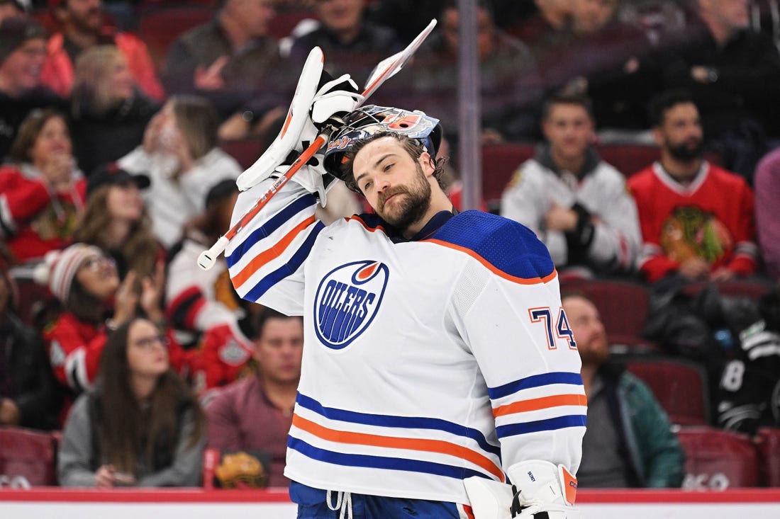 Nov 30, 2022; Chicago, Illinois, USA;  Edmonton Oilers goaltender Stuart Skinner (74) takes a breather against the Chicago Blackhawks at United Center. Mandatory Credit: Jamie Sabau-USA TODAY Sports