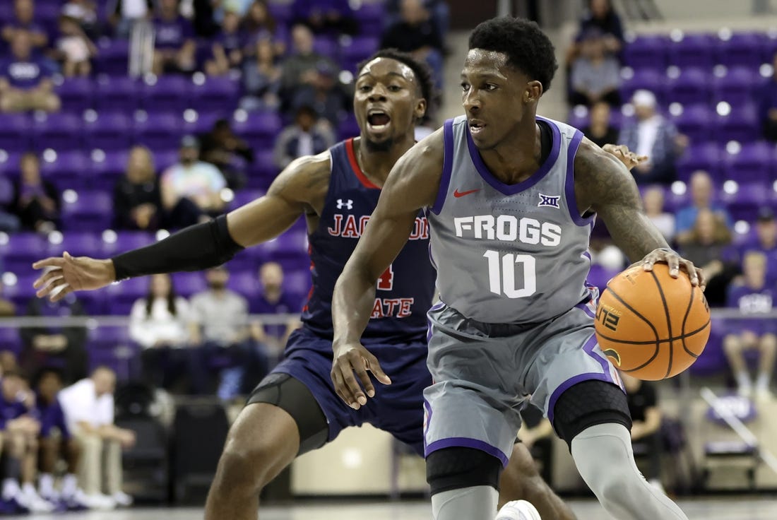 Dec 6, 2022; Fort Worth, Texas, USA;  TCU Horned Frogs guard Damion Baugh (10) controls the ball as Jackson State Tigers guard Coltie Young (4) defends during the first half at Ed and Rae Schollmaier Arena. Mandatory Credit: Kevin Jairaj-USA TODAY Sports