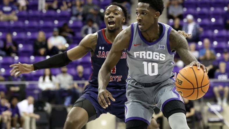 Dec 6, 2022; Fort Worth, Texas, USA;  TCU Horned Frogs guard Damion Baugh (10) controls the ball as Jackson State Tigers guard Coltie Young (4) defends during the first half at Ed and Rae Schollmaier Arena. Mandatory Credit: Kevin Jairaj-USA TODAY Sports