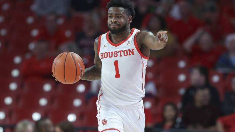 Dec 6, 2022; Houston, Texas, USA; Houston Cougars guard Jamal Shead (1) dribbles the ball during the first half against the North Florida Ospreys at Fertitta Center. Mandatory Credit: Troy Taormina-USA TODAY Sports