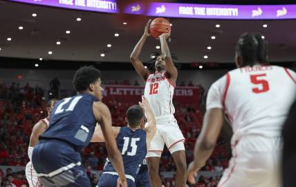 Dec 6, 2022; Houston, Texas, USA; Houston Cougars guard Tramon Mark (12) shoots the ball during the first half against the North Florida Ospreys at Fertitta Center. Mandatory Credit: Troy Taormina-USA TODAY Sports