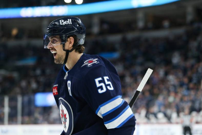 Dec 6, 2022; Winnipeg, Manitoba, CAN;  Winnipeg Jets forward Mark Scheifele (55) celebrates his goal against the Florida Panthers during the second period at Canada Life Centre. Mandatory Credit: Terrence Lee-USA TODAY Sports