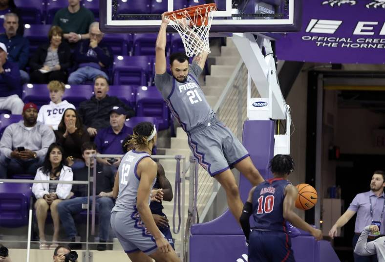 Dec 6, 2022; Fort Worth, Texas, USA;  TCU Horned Frogs forward JaKobe Coles (21) dunks during the second half against the Jackson State Tigers at Ed and Rae Schollmaier Arena. Mandatory Credit: Kevin Jairaj-USA TODAY Sports