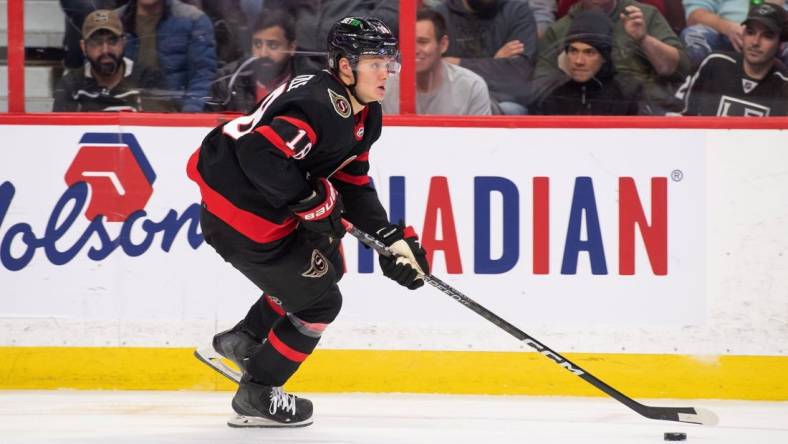 Dec 6, 2022; Ottawa, Ontario, CAN; Ottawa Senators left wing Tim Stutzle (18) skates with the puck in the second period against the Los Angeles Kings at the Canadian Tire Centre. Mandatory Credit: Marc DesRosiers-USA TODAY Sports