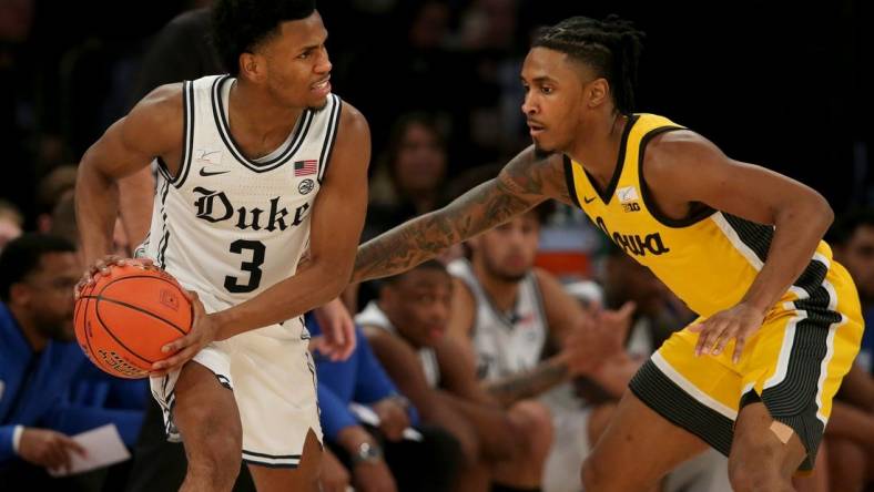 Dec 6, 2022; New York, New York, USA; Duke Blue Devils guard Jeremy Roach (3) controls the ball against Iowa Hawkeyes guard Ahron Ulis (1) during the second half at Madison Square Garden. Mandatory Credit: Brad Penner-USA TODAY Sports