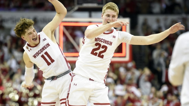 Dec 6, 2022; Madison, Wisconsin, USA;  Wisconsin Badgers guard Max Klesmit (11) and forward Steven Crowl (22) celebrate their win over the Maryland Terrapins at the Kohl Center. Mandatory Credit: Kayla Wolf-USA TODAY Sports