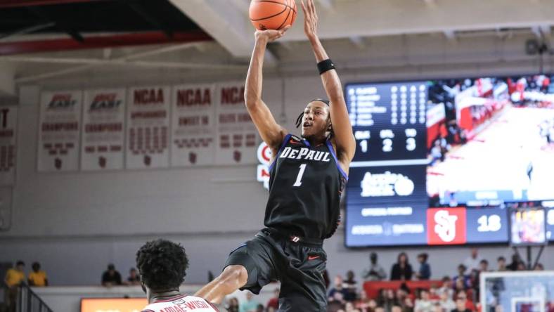 Dec 7, 2022; Queens, New York, USA; DePaul Blue Demons forward Javan Johnson (1) takes a three point shot in the first half against the St. John's Red Storm at Carnesecca Arena. Mandatory Credit: Wendell Cruz-USA TODAY Sports