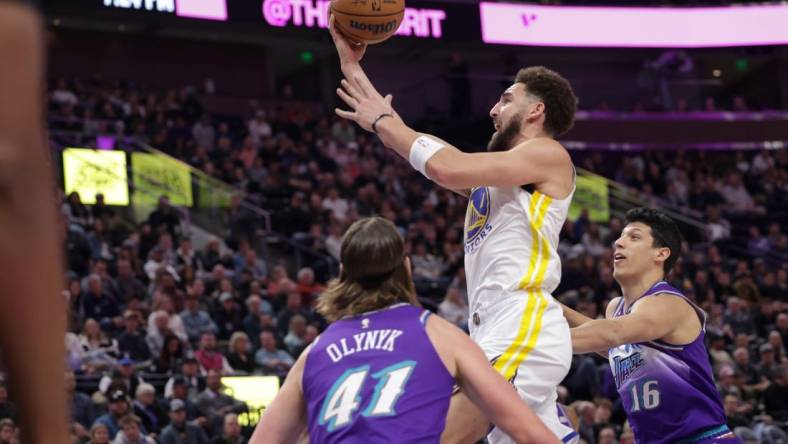 Dec 7, 2022; Salt Lake City, Utah, USA; Golden State Warriors guard Klay Thompson (11) attempts a shot during the first quarter against the Utah Jazz at Vivint Arena. Mandatory Credit: Chris Nicoll-USA TODAY Sports