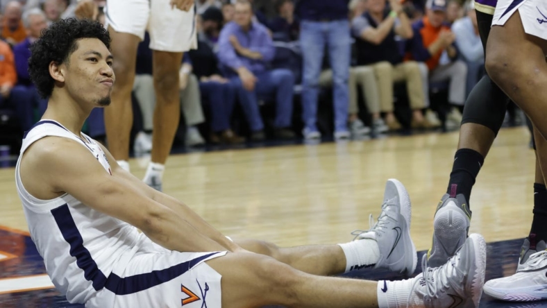 Dec 6, 2022; Charlottesville, Virginia, USA; Virginia Cavaliers guard Kihei Clark (0) reacts after scoring while being fouled James Madison Dukes in the second half at John Paul Jones Arena. Mandatory Credit: Geoff Burke-USA TODAY Sports