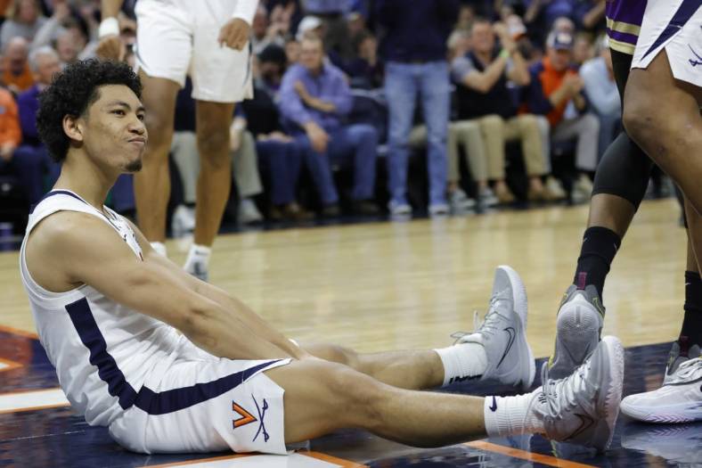 Dec 6, 2022; Charlottesville, Virginia, USA; Virginia Cavaliers guard Kihei Clark (0) reacts after scoring while being fouled James Madison Dukes in the second half at John Paul Jones Arena. Mandatory Credit: Geoff Burke-USA TODAY Sports