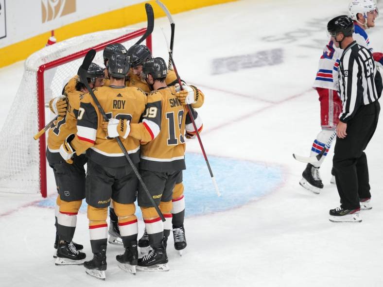 Dec 7, 2022; Las Vegas, Nevada, USA; Vegas Golden Knights players celebrate a goal scored by Vegas Golden Knights center Jonathan Marchessault (81) during the second period against the New York Rangers at T-Mobile Arena. Mandatory Credit: Stephen R. Sylvanie-USA TODAY Sports