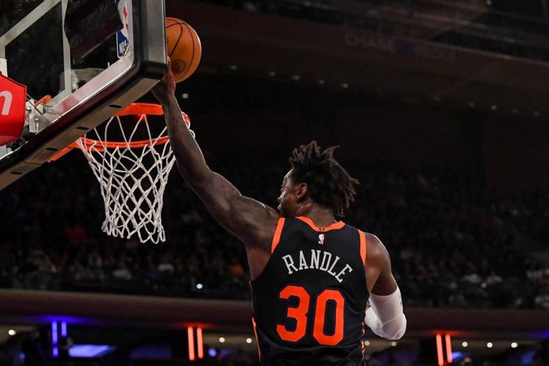 Dec 7, 2022; New York, New York, USA;  New York Knicks forward Julius Randle (30) attempts a lay up against the Atlanta Hawks during the third quarter  at Madison Square Garden. Mandatory Credit: Dennis Schneidler-USA TODAY Sports