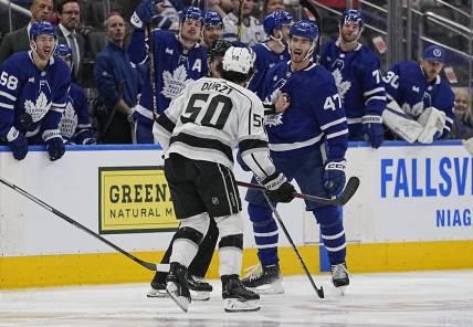 Dec 8, 2022; Toronto, Ontario, CAN; Toronto Maple Leafs forward Pierre Engvall (47) and Los Angeles Kings defenseman Sean Durzi (50) exchange words after a hit during the third period at Scotiabank Arena. Mandatory Credit: John E. Sokolowski-USA TODAY Sports