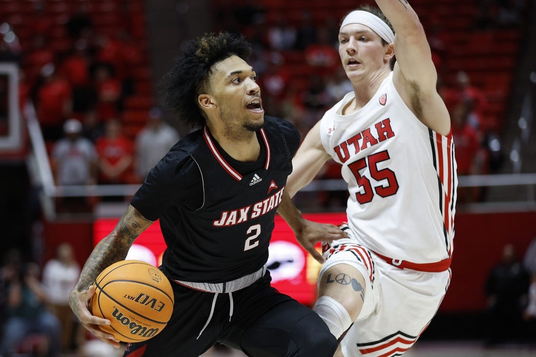 Dec 8, 2022; Salt Lake City, Utah, USA; Jacksonville State Gamecocks guard Cam McDowell (2) looks to drive against Utah Utes guard Gabe Madsen (55) in the first half at Jon M. Huntsman Center. Mandatory Credit: Jeffrey Swinger-USA TODAY Sports