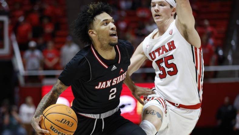 Dec 8, 2022; Salt Lake City, Utah, USA; Jacksonville State Gamecocks guard Cam McDowell (2) looks to drive against Utah Utes guard Gabe Madsen (55) in the first half at Jon M. Huntsman Center. Mandatory Credit: Jeffrey Swinger-USA TODAY Sports