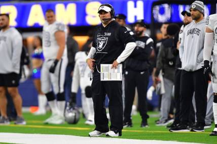 Dec 8, 2022; Inglewood, California, USA; Las Vegas Raiders head coach Josh McDaniels watches game action against the Los Angeles Rams during the second half at SoFi Stadium. Mandatory Credit: Gary A. Vasquez-USA TODAY Sports