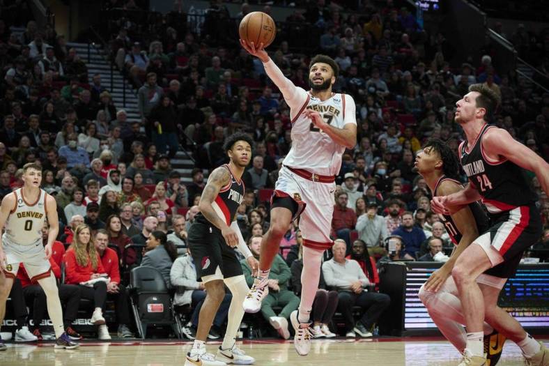 Dec 8, 2022; Portland, Oregon, USA; Denver Nuggets guard Jamal Murray (27) scores a layup during the second half against the Portland Trail Blazers at Moda Center. The Nuggets won the game 121-120. Mandatory Credit: Troy Wayrynen-USA TODAY Sports