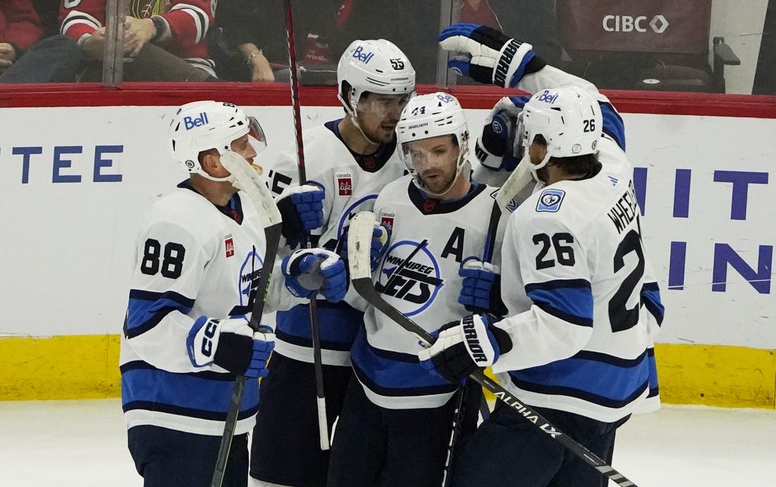 Dec 9, 2022; Chicago, Illinois, USA; The Winnipeg Jets celebrate a goal against the Chicago Blackhawks during the first period at United Center. Mandatory Credit: David Banks-USA TODAY Sports