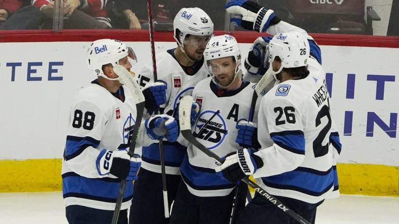 Dec 9, 2022; Chicago, Illinois, USA; The Winnipeg Jets celebrate a goal against the Chicago Blackhawks during the first period at United Center. Mandatory Credit: David Banks-USA TODAY Sports