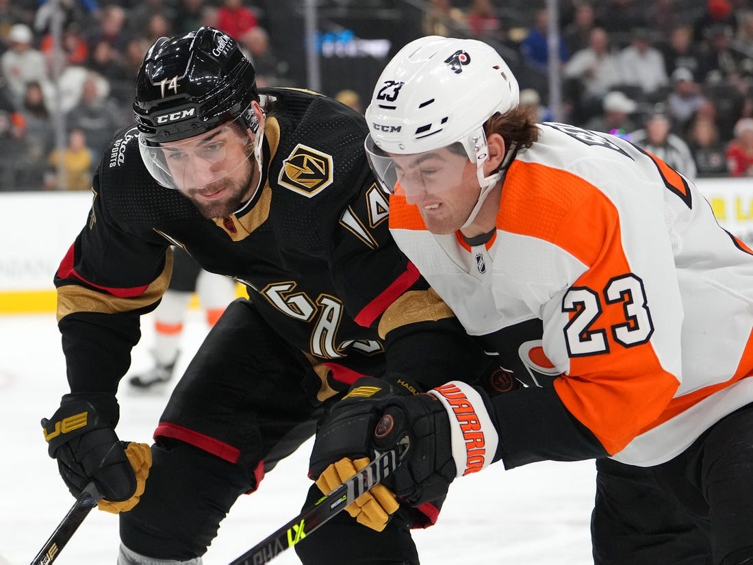 Dec 9, 2022; Las Vegas, Nevada, USA; Vegas Golden Knights defenseman Nicolas Hague (14) skates against Philadelphia Flyers center Lukas Sedlak (23) during the first period at T-Mobile Arena. Mandatory Credit: Stephen R. Sylvanie-USA TODAY Sports