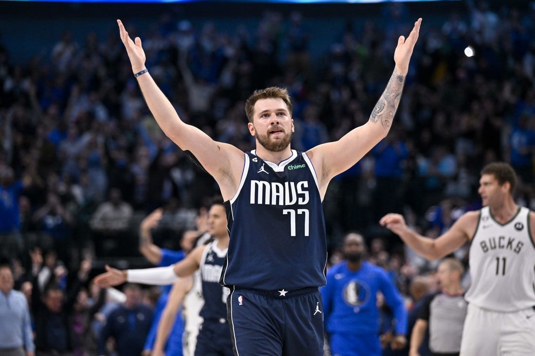 Dec 9, 2022; Dallas, Texas, USA; Dallas Mavericks guard Luka Doncic (77) motions the Mavericks fans during the second half of the game against the Milwaukee Bucks at the American Airlines Center. Mandatory Credit: Jerome Miron-USA TODAY Sports