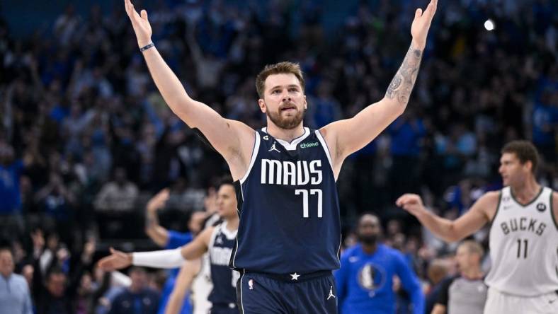 Dec 9, 2022; Dallas, Texas, USA; Dallas Mavericks guard Luka Doncic (77) motions the Mavericks fans during the second half of the game against the Milwaukee Bucks at the American Airlines Center. Mandatory Credit: Jerome Miron-USA TODAY Sports