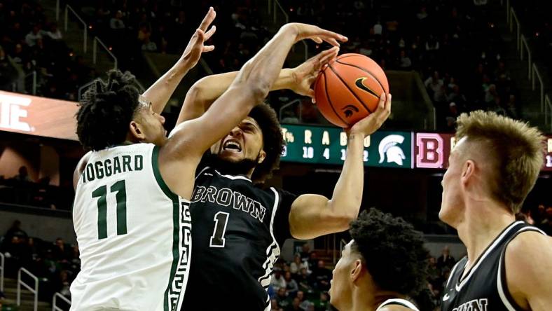 Dec 10, 2022; East Lansing, Michigan, USA;  Michigan State Spartans guard A.J. Hoggard (11) stops Brown Bears guard Dan Friday (1) at Jack Breslin Student Events Center. Mandatory Credit: Dale Young-USA TODAY Sports