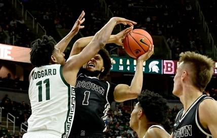 Dec 10, 2022; East Lansing, Michigan, USA;  Michigan State Spartans guard A.J. Hoggard (11) stops Brown Bears guard Dan Friday (1) at Jack Breslin Student Events Center. Mandatory Credit: Dale Young-USA TODAY Sports
