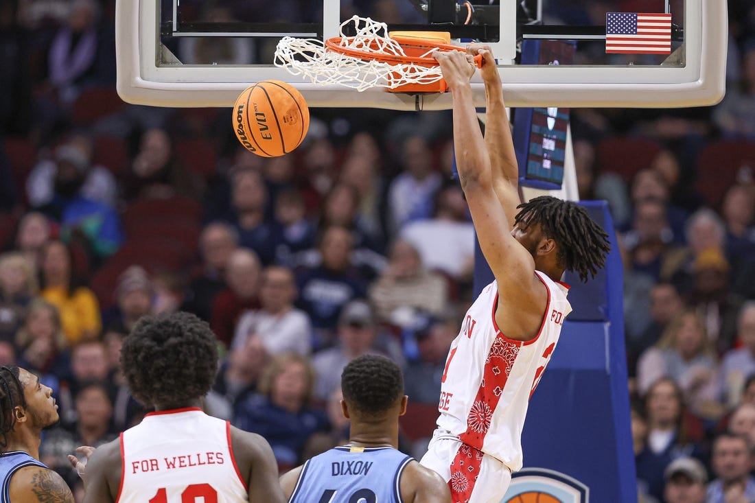 Dec 10, 2022; Newark, New Jersey, USA; Boston College Eagles forward Devin McGlockton (21) dunks the ball against Villanova Wildcats forward Eric Dixon (43) during the second half at Prudential Center. Mandatory Credit: Vincent Carchietta-USA TODAY Sports