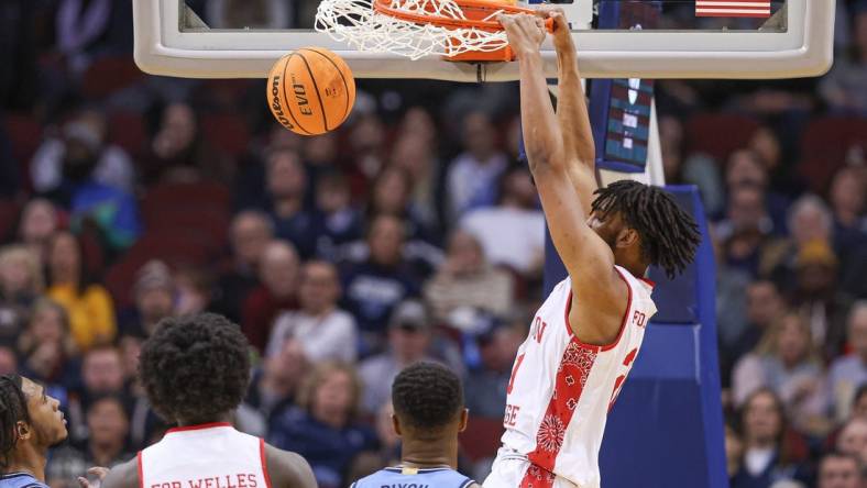 Dec 10, 2022; Newark, New Jersey, USA; Boston College Eagles forward Devin McGlockton (21) dunks the ball against Villanova Wildcats forward Eric Dixon (43) during the second half at Prudential Center. Mandatory Credit: Vincent Carchietta-USA TODAY Sports