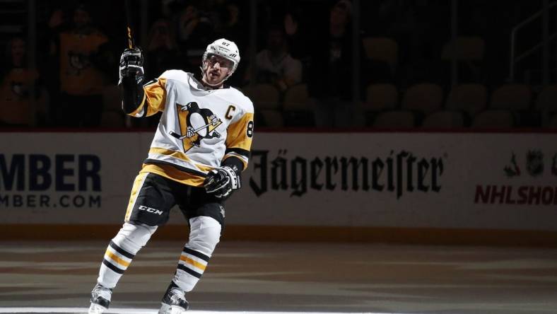 Dec 10, 2022; Pittsburgh, Pennsylvania, USA; Pittsburgh Penguins center Sidney Crosby (87) waves to the crowd after being named first star of the game against the Buffalo Sabres at PPG Paints Arena. The Penguins won 3-1. Mandatory Credit: Charles LeClaire-USA TODAY Sports