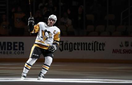 Dec 10, 2022; Pittsburgh, Pennsylvania, USA; Pittsburgh Penguins center Sidney Crosby (87) waves to the crowd after being named first star of the game against the Buffalo Sabres at PPG Paints Arena. The Penguins won 3-1. Mandatory Credit: Charles LeClaire-USA TODAY Sports