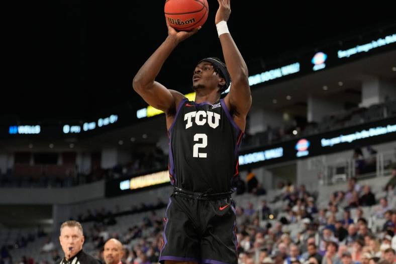 Dec 10, 2022; Fort Worth, Texas, USA;  TCU Horned Frogs forward Emanuel Miller (2) makes a three point basket against the Southern Methodist Mustangs during the first half at Dickies Arena. Mandatory Credit: Chris Jones-USA TODAY Sports