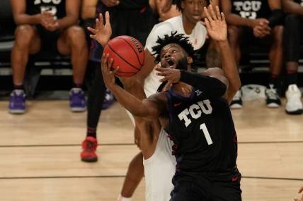 Dec 10, 2022; Fort Worth, Texas, USA;  TCU Horned Frogs guard Mike Miles Jr. (1) shoots the ball against Southern Methodist Mustangs forward Keon Ambrose-Hylton (22) during the second half at Dickies Arena. Mandatory Credit: Chris Jones-USA TODAY Sports