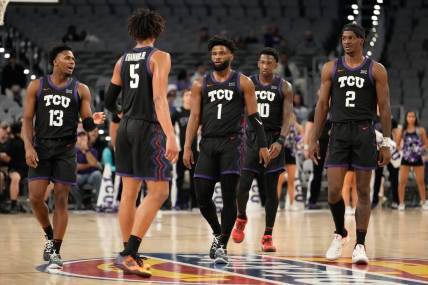 Dec 10, 2022; Fort Worth, Texas, USA;  The TCU Horned Frogs huddle during a break in play in the second half against the Southern Methodist Mustangs at Dickies Arena. Mandatory Credit: Chris Jones-USA TODAY Sports
