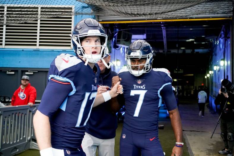 Dec 11, 2022; Nashville, Tennessee, USA; Tennessee Titans quarterbacks Ryan Tannehill (17) and Malik Willis (7) head to the field as the team gets ready to face the Jacksonville Jaguars at Nissan Stadium. Mandatory Credit: George Walker IV/The Tennessean-USA TODAY Sports