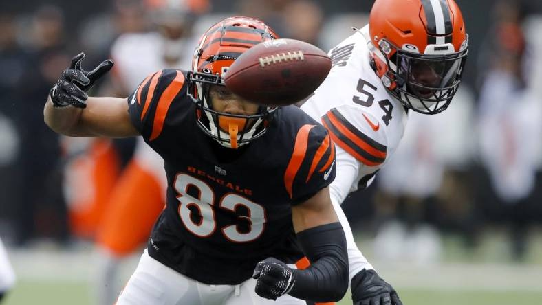 Dec 11, 2022; Cincinnati, Ohio, USA;  Cincinnati Bengals wide receiver Tyler Boyd (83) has the ball stripped by Cleveland Browns linebacker Deion Jones (54) during the first quarter at Paycor Stadium. Mandatory Credit: Joseph Maiorana-USA TODAY Sports