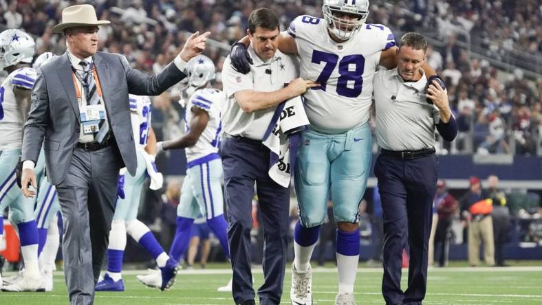 Dec 11, 2022; Arlington, Texas, USA; Dallas Cowboys offensive tackle Terence Steele (78) leaves the field with an apparent injury during the second quarter against the Houston Texans at AT&T Stadium. Mandatory Credit: Raymond Carlin III-USA TODAY Sports