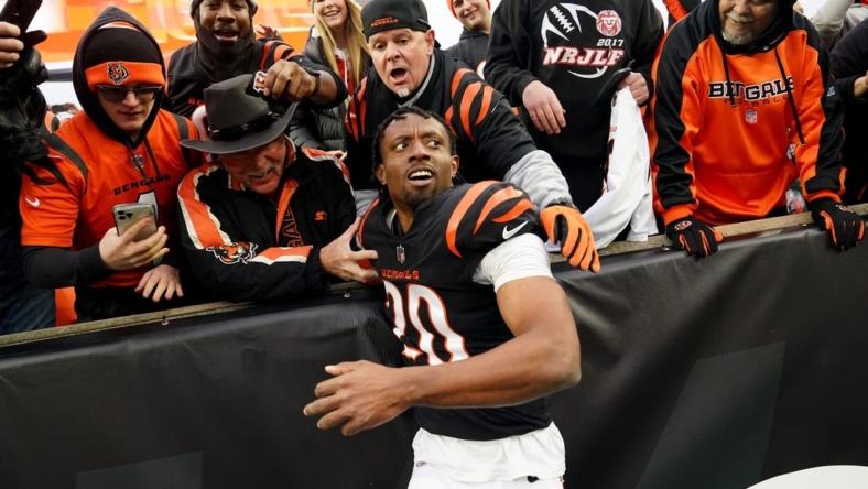 Dec 11, 2022; Cincinnati, Ohio, USA; Cincinnati Bengals cornerback Eli Apple (20) leaps into the stands with the fans at the conclusion of a Week 14 NFL game against the Cleveland Browns, Sunday, Dec. 11, 2022, at Paycor Stadium in Cincinnati. The Cincinnati Bengals won, 23-10.  Mandatory Credit: Kareem Elgazzar-USA TODAY Sports